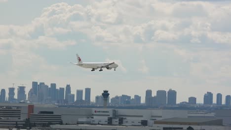 Aircraft-Flying-Over-Toronto-City-skyline-On-Final-Approach-To-Pearson-International-Airport
