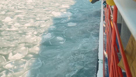 View-Over-Railing-Of-Garinko-II-Ice-Breaker-Cruise-Ship-Going-Through-Drift-Sea-Ice-Off-Monbetsu