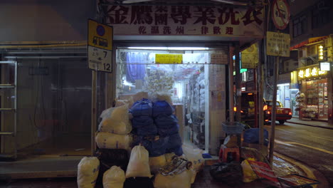 Small-Asian-Kiosk-on-the-Street-Corner-in-Downton-Hong-Kong-at-nighttime