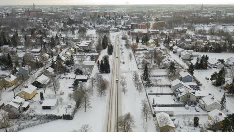 Aerial-forward-moving-fly-over-view-over-Turku-suburb-in-winter-time-after-snowfall