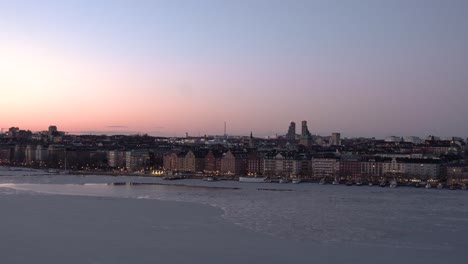 Wide-view-over-pink-and-orange-sky-over-Stockholm