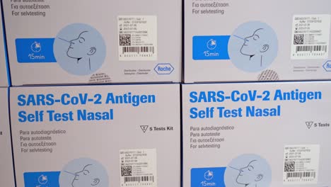 Boxes-with-covid-antigen-tests-stacked-on-top-of-each-other---Closeup-slider-left-to-right-showing-front-of-packaging---5-pack-test-kit-from-Roche