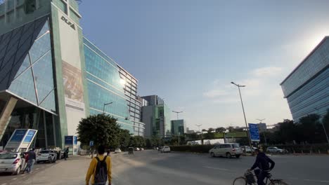 Ultra-wide-shot-of-right-pan-shot-of-people-walking-in-cyber-city,-Gurugram,-India