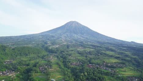 Drone:-Rural-aerial-view-of-Central-Java,-Indonesia-With-Mount-Sumbing-in-background---Beautiful-scenery-green-scenery-with-village-and-plantation