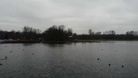 Gloomy-Sky-Over-The-Recreational-Lake-Of-Kralingse-Plas,-Rotterdam-In-The-Netherlands-Full-Of-Ducks-And-Birds-Freely-Roaming-The-Area