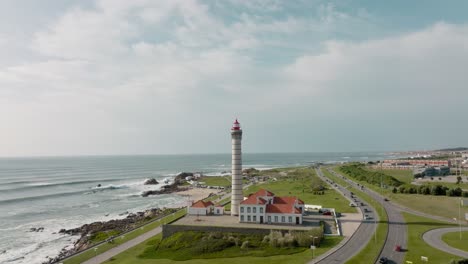 Aerial-view-over-the-lighthouse-and-Capela-da-Boa-Nova-in-Leça-da-Palmeira,-Matosinhos