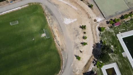 Rising-Aerial-Shot-Of-A-Recreational-Football-Pitch-And-Sport-Field