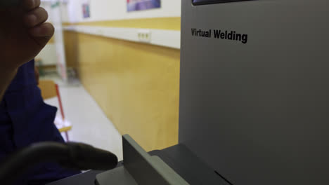 Extreme-Close-Up-Of-Virtual-Welding-Machine-In-A-Trade-High-School