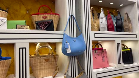 High-quality-fake-designer-bags-on-shelves-in-Turkey-store,-fake-luxury-brand-bags,-knock-off-superfakes-of-prada,-gucci-and-chanel,-4K-shot