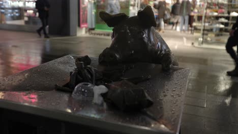 Located-in-Rundle-Mall-Adelaide-South-Australia,-these-life-sized-pigs-look-to-be-having-a-great-day-out-in-Rundle-Mall-as-they-walk-the-Mall,-dig-through-the-bin-for-food-scraps-and-greet-passers-by
