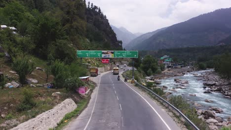 Aerial-drone-shot-of-Manali-street-and-water-stream-flowing-near