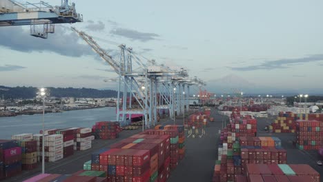 Industrial-Port-With-Containers-And-Cranes-At-Husky-Terminal,-Tacoma,-Washington---drone-descending