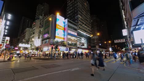 Frenzied-nighttime-activity-on-streets-of-Mong-Kok,-Hong-Kong