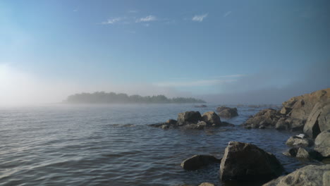 Scenic-view-of-rocky-Helsinki-archipelago-and-islands-in-fog