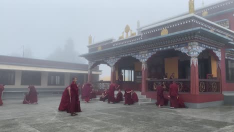 Buddhist-monks-participate-at-a-debate-session-at-the-Lava-monastery-in-West-Bengal,-India