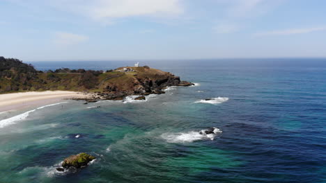 Approaching-the-Tacking-Point-Lighthouse-Rocky-Cliff-at-Port-Macquarie-Australia,-Aerial-Landscape-view