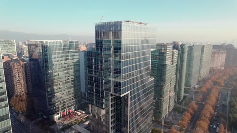 Aerial-view-dolly-in-the-business-center-of-Las-Condes,-Parque-Araucano,-Santiago,-Chile
