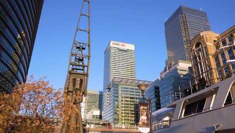 Canary-Wharf-London-United-Kingdom-July-2022-Wide-establishing-shot-of-HSBC-behind-iconic-shipping-crane-and-boat