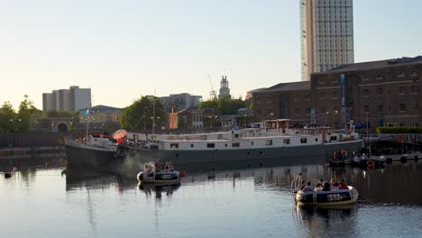 London-England-Canary-Wharf-Aug-2022-view-of-West-India-Quay-boats-and-people-enjoying-the-evening