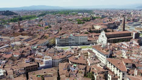 City-Buildings-by-Santa-Maria-Novella-Church-in-Florence,-Italy---Aerial