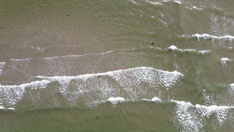 Foamy-waves-of-the-north-pacific-ocean-crashing-ashore-at-British-Columbia's-sunshine-coast