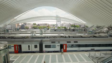 Railway-station-Liège-Guillemins-with-urban-city-center-of-Liège-in-background---Wide-angle-panning-shot