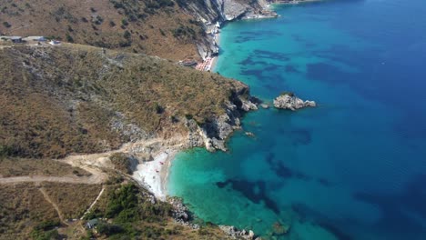 Drone-shot-of-the-Albanian-coast-in-the-Mediterranean-sea---drone-is-flying-500m-high-showing-two-lonely-beaches