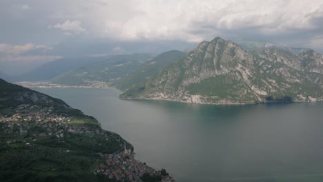 Drone-view-at-Lake-Iseo-and-Mount-Corna-Trentapassi-at-sunny-day-with-clouds