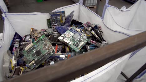 Steady-medium-moving-shot-of-electronic-parts-ready-for-recycling