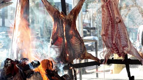 Roasted-goat-prepared-in-a-typical-argentinian-grill-near-fire