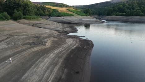 Aerial-drone-flight-around-Goyt-Valley-Errwood-Reservior-showing-the-low-water-levels-caused-by-heatwave-Part-3