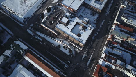 Flying-above-main-intersection-in-Nitra-City-Centre,-Winter,-Top-down-Aerial-shot,-Slovakia