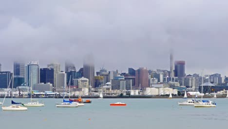 Timelpase-of-Auckland-City,-a-mist-covering-the-skytower,-New-Zealand
