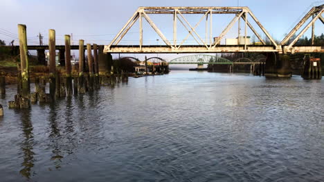 Large-steel-pivot-railroad-bridge-spanning-the-Umpqua-River-bay-near-Reedsport-Oregon
