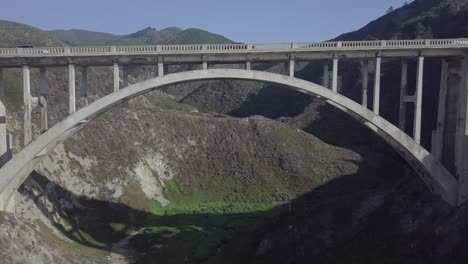 Aerial-Drone-Shot-of-Bixby-Bridge-with-Road-and-Vehicles