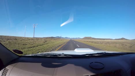 Time-lapse-of-driving-vehicle-at-passengers-side-with-a-view-of-summer-green-fields
