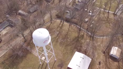 Point-of-interest-aerial-footage-of-a-water-tower-in-rural-Odin,-Illinois
