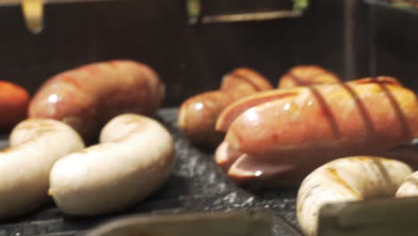 BBQ-Grill-Sausages-Ready-Hot-Smoke-Hand-Turning-over-Close-up-Juicy-Dripping