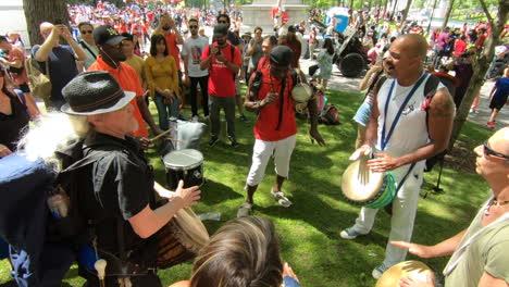 People-watching-a-percussion-outside-show-in-park,-Percussion-performers,-musicians,-band-playing-percussion,-drum-instruments,-rhythm-art,-festival,-beat-drummers,-bongo,-drums-performance