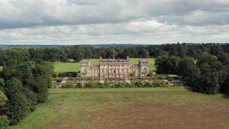 Aerial-Flyaway-from-Harewood-House,-a-Country-House-in-West-Yorkshire,-Revealing-the-Yorkshire-Countryside