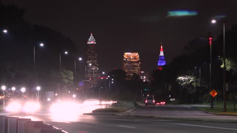 Traffic-passing-timelapse-with-the-downtown-Cleveland-skyline-in-the-background-at-night