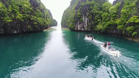Aerial-Shot-Of-Speed-Boats-Cruising-Along-Clear-Waters-In-Palawan-Philippines