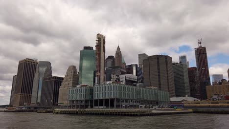 Approaching-the-Financial-District-from-North-at-East-River,-New-York-City