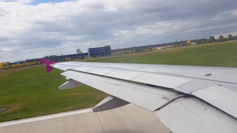 An-Airbus-A320-taking-off-from-Hannover-Flughafen-in-Hanover,-Germany-on-a-partly-cloudy-day