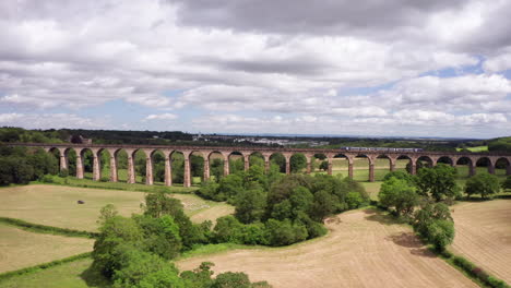 Forwards-Dolly-Shot-of-Crimple-Valley-Viaduct-in-North-Yorkshire-with-a-Northern-Train-Crossing