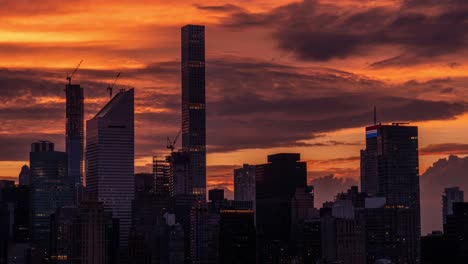 Time-lapse-of-clouds-at-red-sunset-over-the-skyscrapers-of-Manhattan-Midtown-East,-New-York-City-at-June-2019
