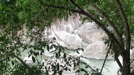 Stream-flowing-water-with-rocky-terrain-in-a-public-park