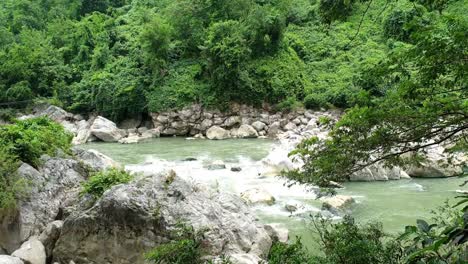 Stream-flowing-water-with-rocky-terrain-in-a-public-park