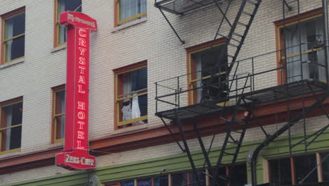 Close-up-of-McMenamins-Crystal-Hotel-and-Zeus-Cafe-Sign-in-Portland,-Oregon,-USA