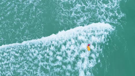 4k-Top-Down-Aerial-Shot-of-people-learning-to-surf-in-Pondicherry-Beach